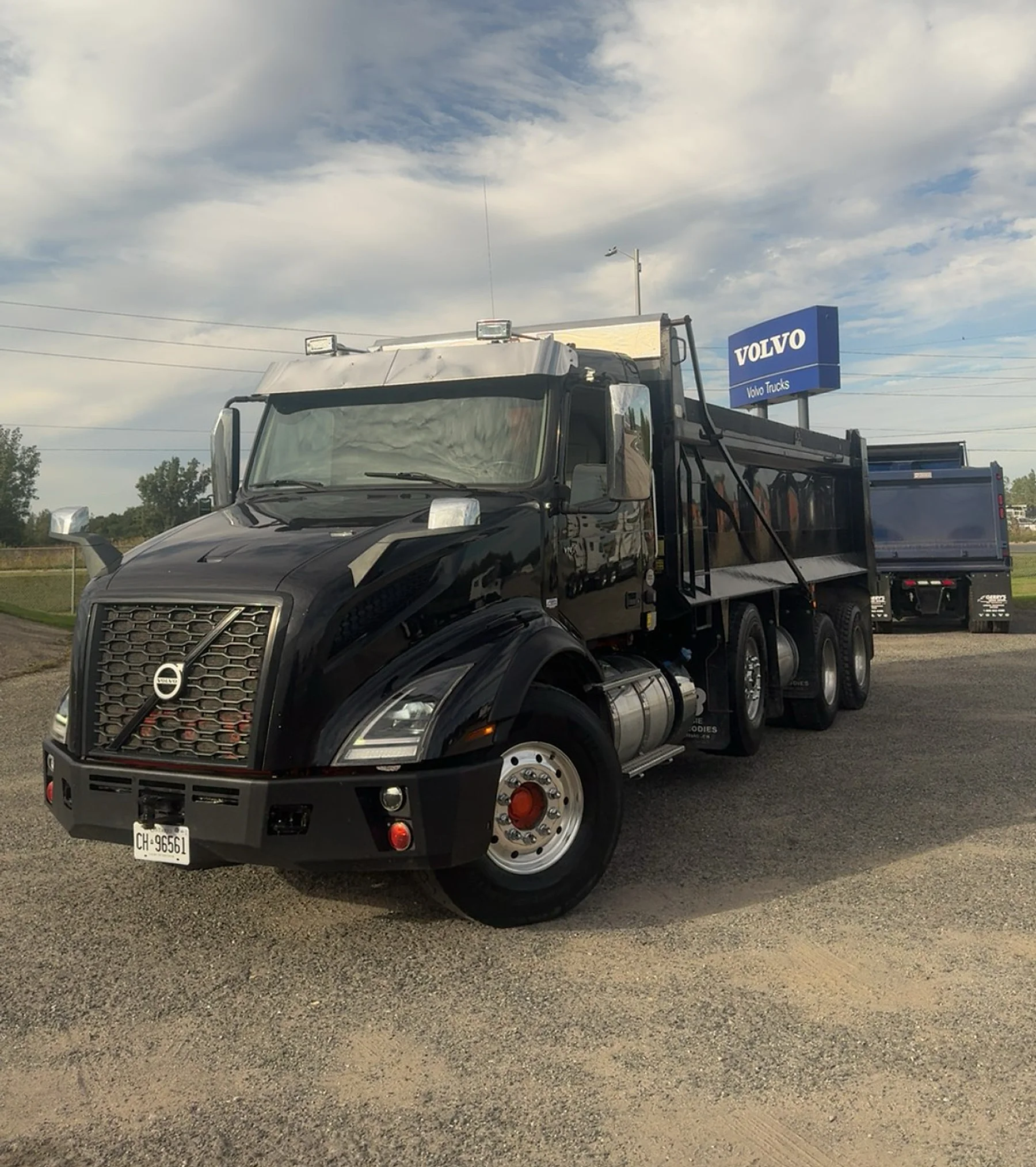 The newest truck in the 5Rivers fleet, a black Volvo tri-axle dump truck