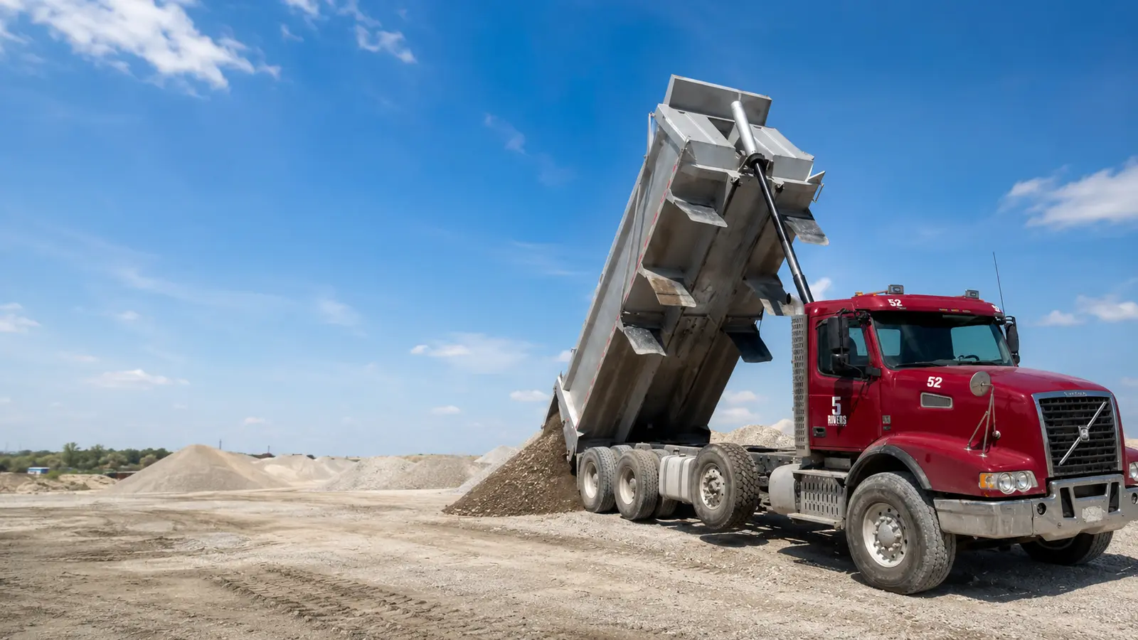 A 5Rivers dump truck tipping granular base material on a site near London, Ontario
